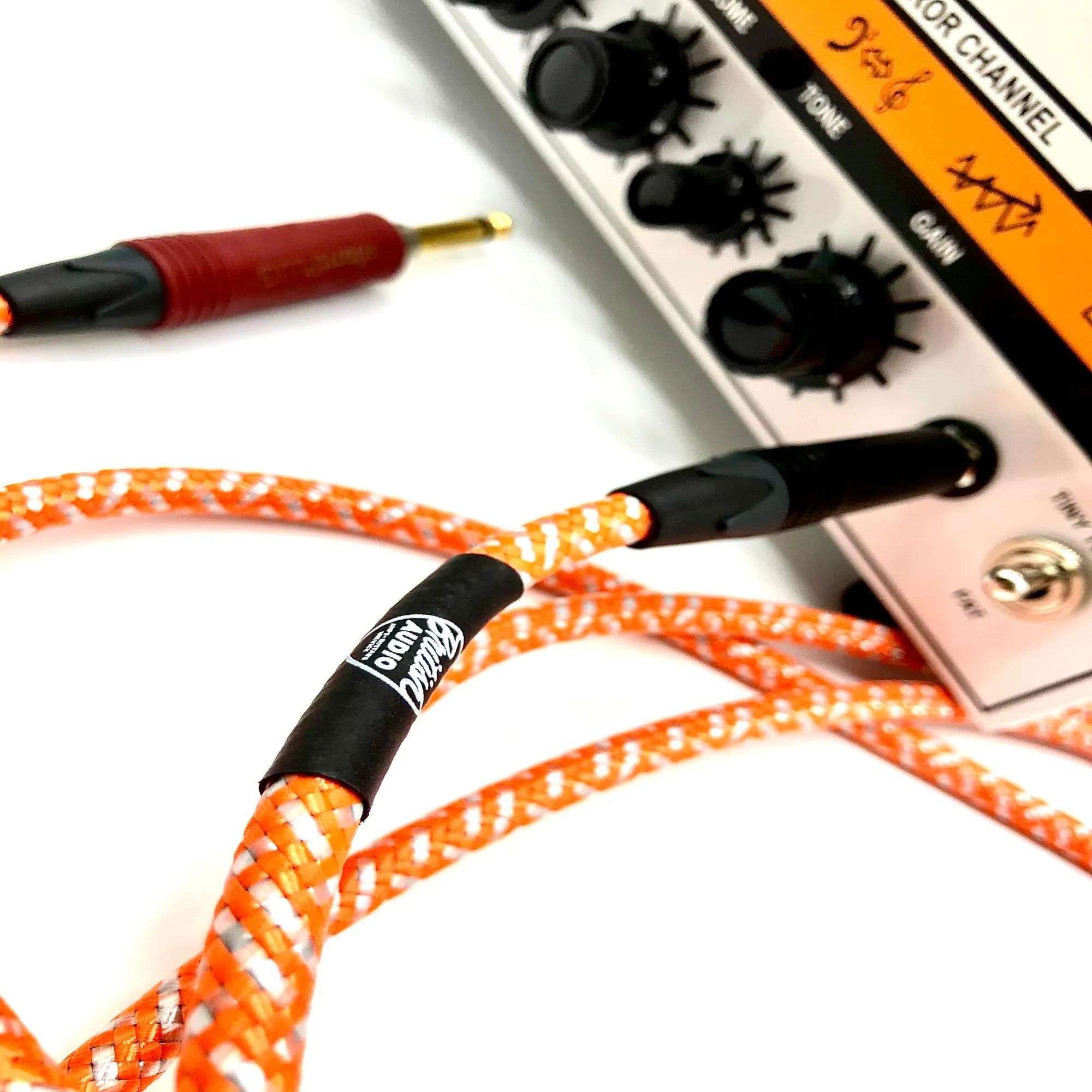 British Audio Pro Performance Silent Instrument Cable - Straight Silent to Straight (Orange & White Braid)